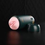 Leten green automatic male masturbator with soft vaginal sleeve, shown with cap removed, displayed on a black background
